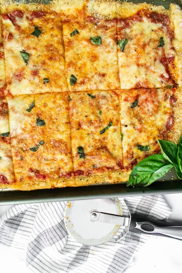 pizza on a baking sheet on a white background