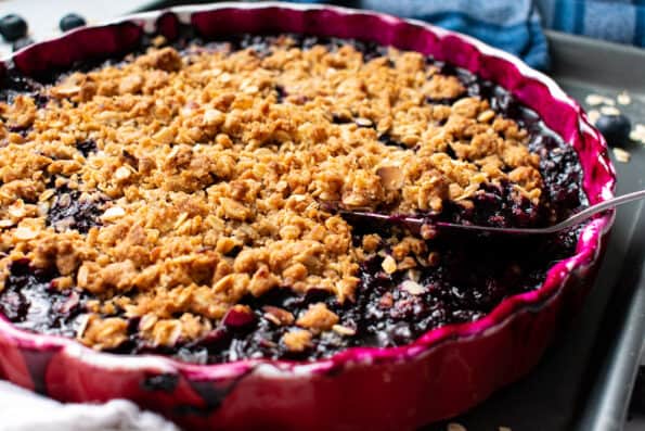 blueberry crumble in pie dish on tray