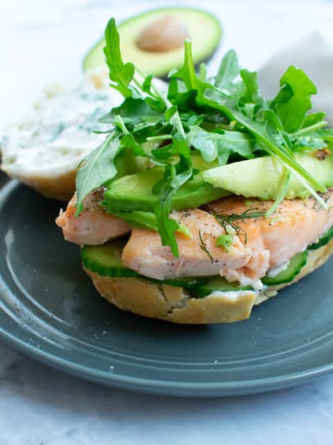 salmon sandwich on a gray plate