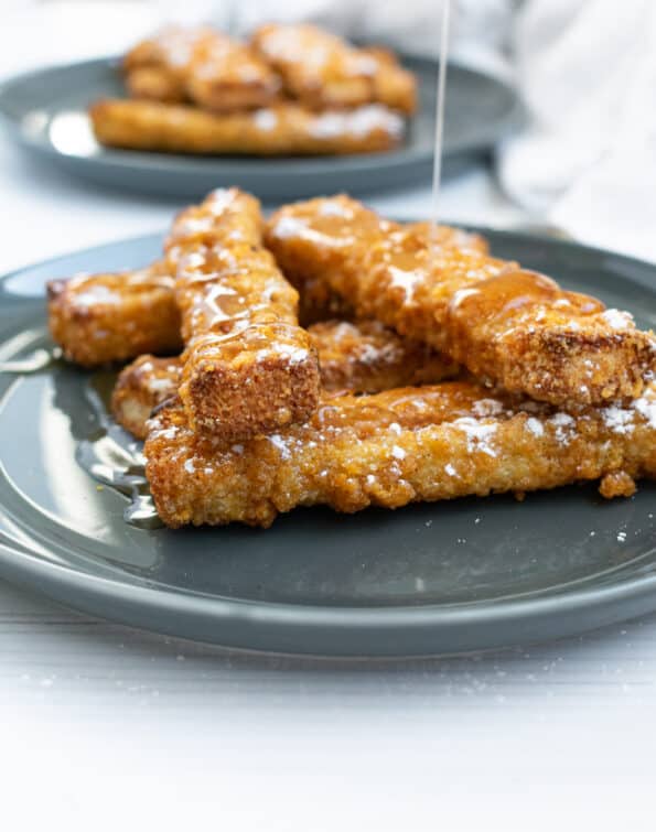 french toast sticks on a gray plate and white background