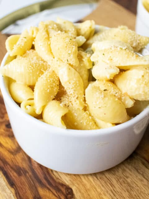 macaroni in a bowl on wood tray
