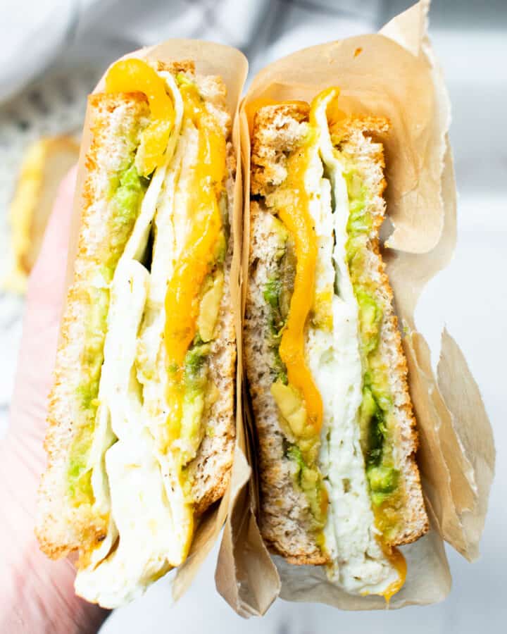 breakfast sandwich being held