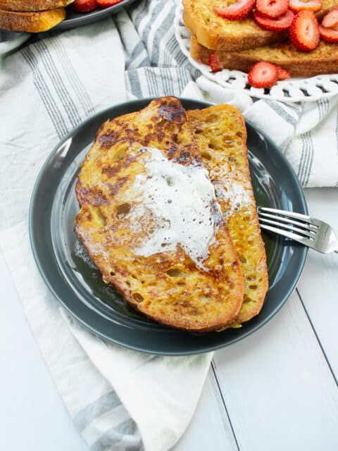 french toast slices on a gray plate and white background